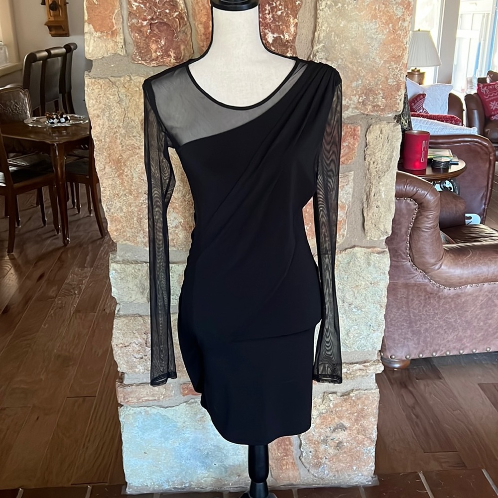 Super flattering black cocktail dress. Excellent condition.